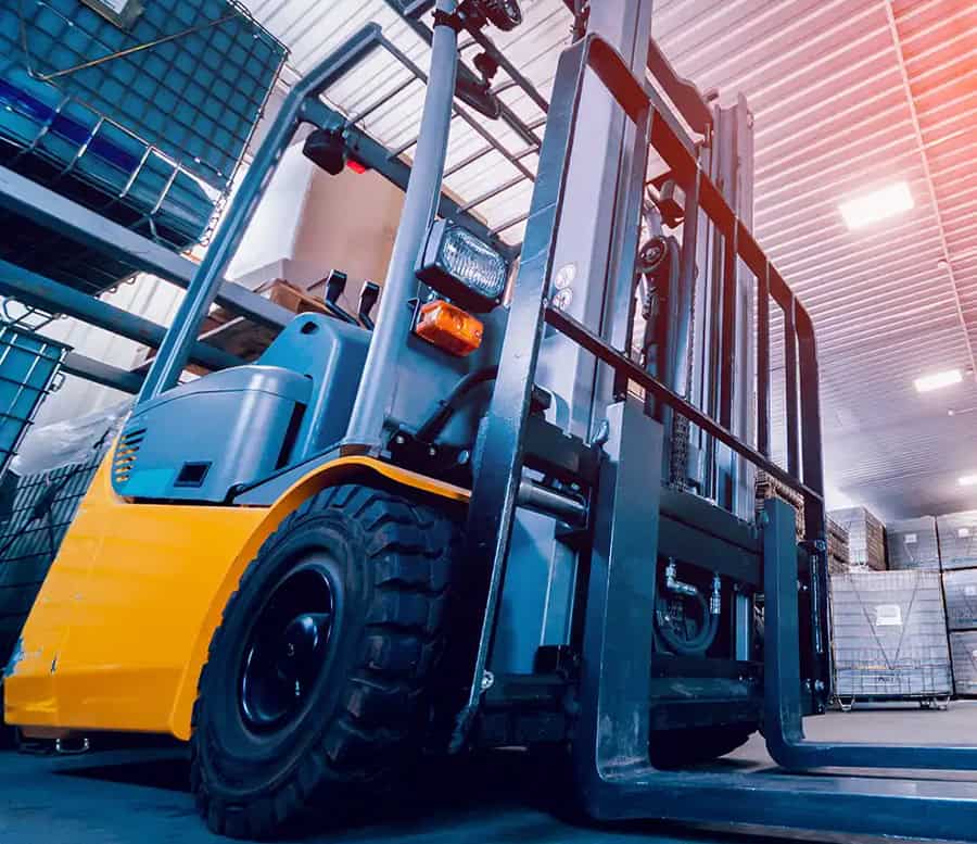 Forklifts in a manufacturing facility