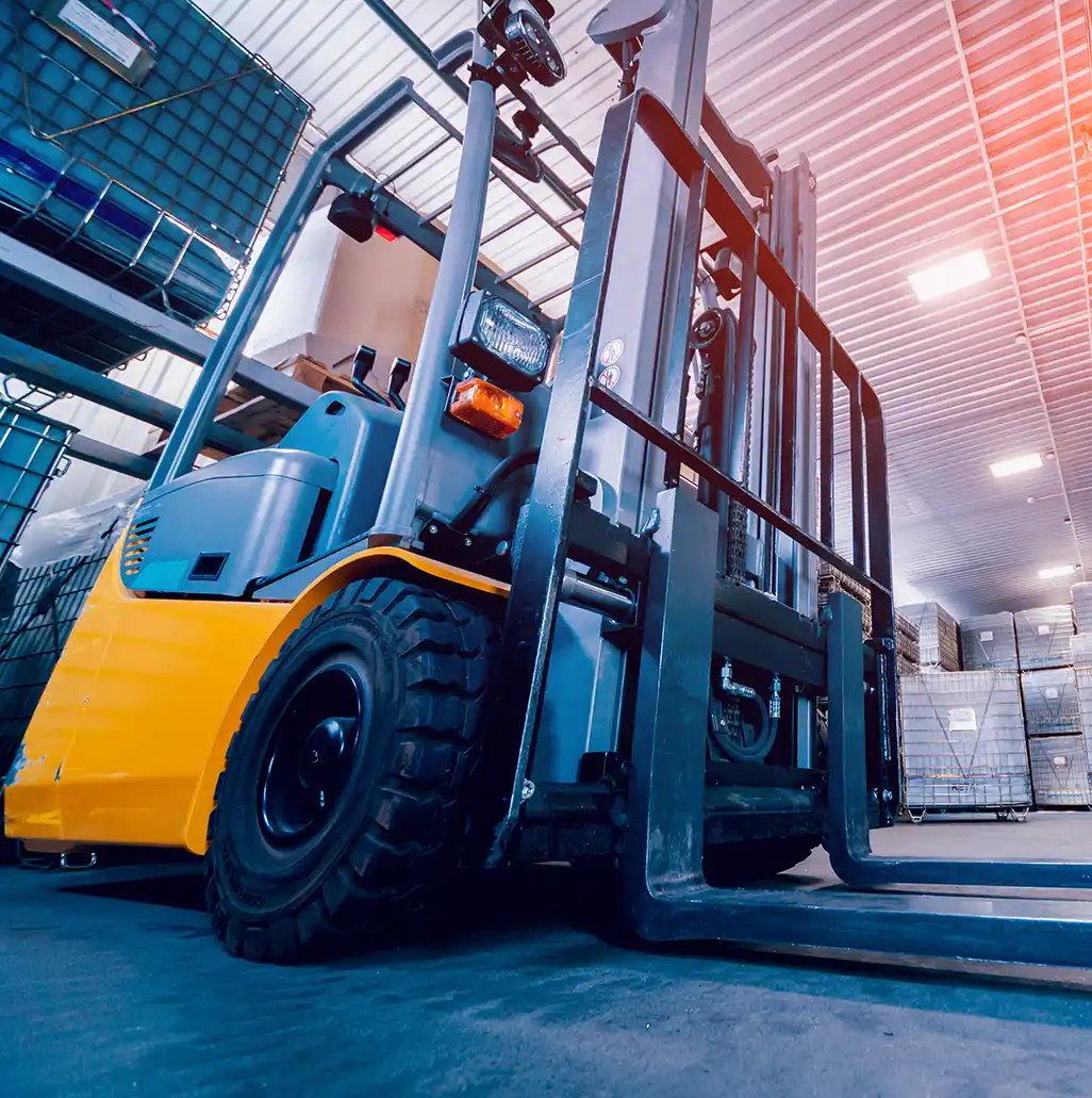 Forklifts in a manufacturing facility